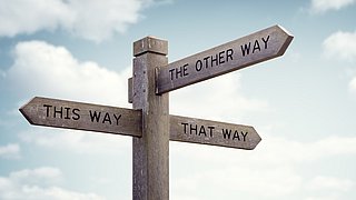 Road sign showing three different directions